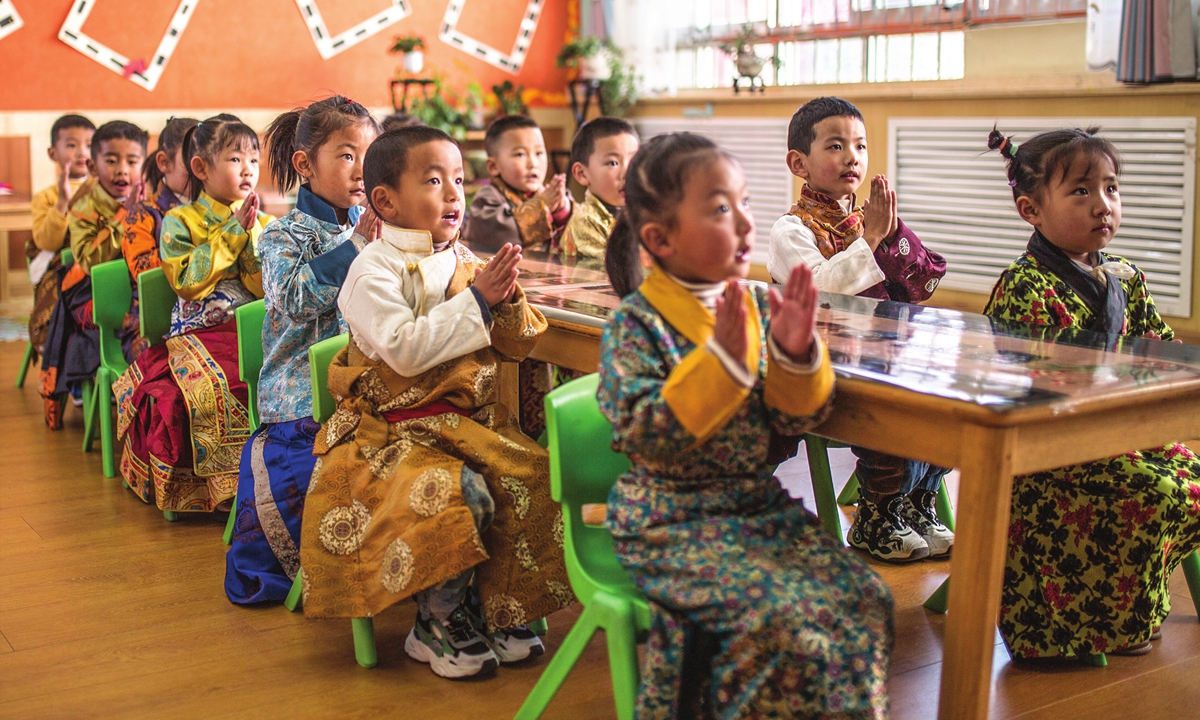 Children dressed in traditional Tibetan costumes study in a class at the Lhasa Experimental Kindergarten in March,2023. Photo: Shan Jie/GT