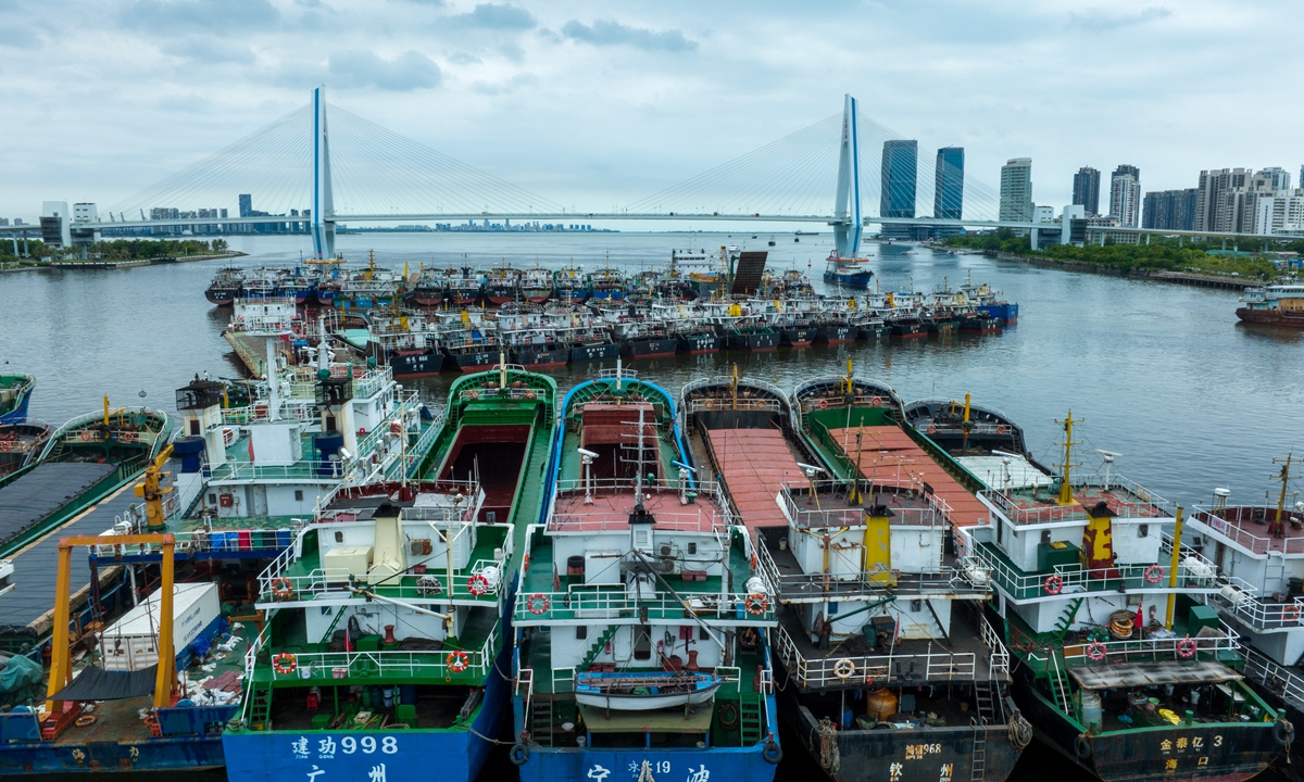 Ships park at a port in Haikou, South China's Hainan Province, on July 16, 2023, before storm Talim makes landfall in China. Photo: VCG 