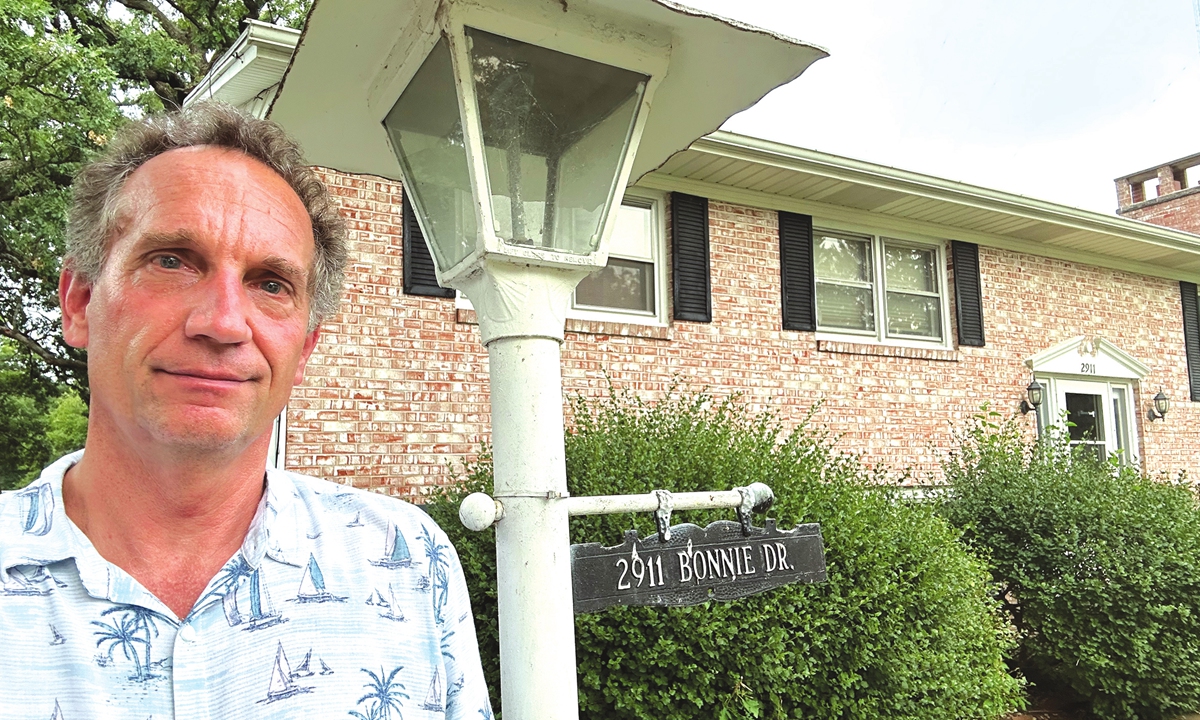 Gary Dvorchak poses for a photo in front of the Sino-US Friendship House in Muscatine, Iowa on July 20, 2023. Photo: Courtesy of Dvorchak