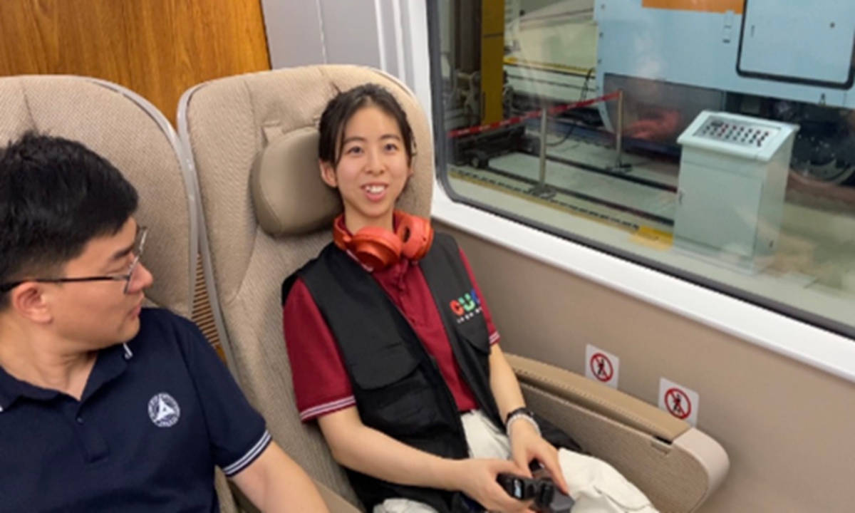 Visitors experience the first class seat of EMU on July 22, 2023. Photo: Yang Yiwen