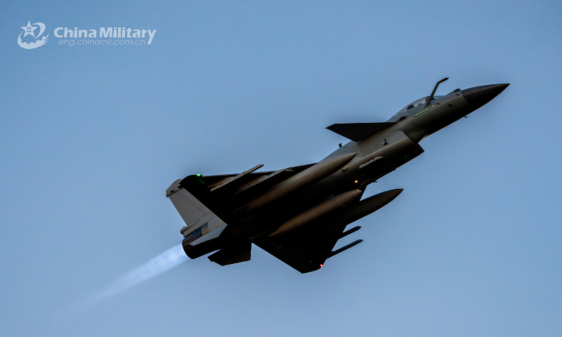 A J-10 fighter jet attached to an aviation brigade of the air force under the PLA Southern Theater Command takes off towards a training airspace at sunrise during a recent flight training exercise. (eng.chinamil.com.cn/Photo by Hou Kaiwen)  