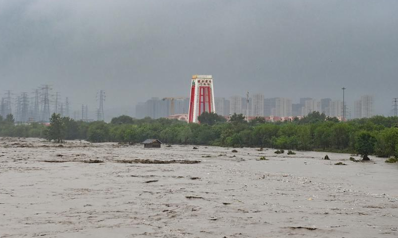 The water level of the Mentougou section of the Yongding River rises due to persistent rainfall in recent days in Mentougou district of Beijing, July 31, 2023. (Photo: China News Service/Tian Yuhao)