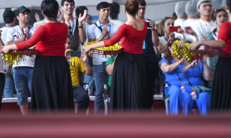 Actors of the State Honored Dance Ensemble of Tajikistan watch performance presented by actors of Xinjiang Art Theater in Xinjiang Art Theater, Urumqi, northwest China's Xinjiang Uygur Autonomous Region, July 31, 2023. A communication activity featuring music and dance was held between actors of the State Honored Dance Ensemble of Tajikistan and actors of Xinjiang Art Theater on Monday. (Xinhua/Wang Fei)