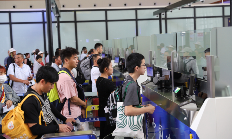 Passengers on a China-Laos Railway train go through customs clearance at Mohan railway port in Southwest China's Yunnan Province, on July 26, 2023. On the previous day, the China-Laos Railway implemented a schedule change, reducing the travel time from Yunnan's Kunming to Vientiane, the capital of Laos, by 64 minutes. Photo: VCG