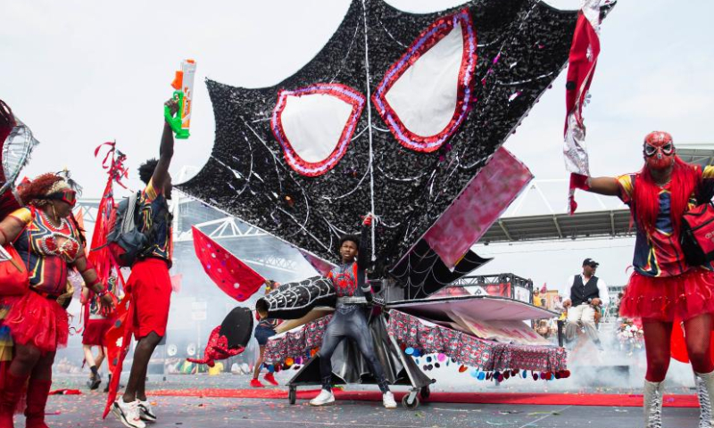 Dressed-up revelers perform on the stage during the Grand Parade of the 2023 Toronto Caribbean Carnival in Toronto, Canada, on Aug. 5, 2023. (Photo by Zou Zheng/Xinhua)