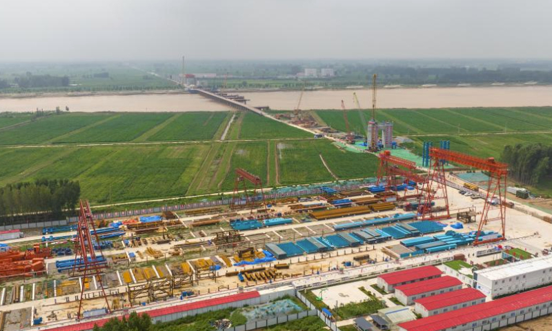 This aerial photo taken on July 31, 2023 shows the construction site of the main bridge of a super major bridge across the Yellow River along the Xiong'an-Shangqiu high-speed railway, in Taiqian County, central China's Henan Province. The super major bridge, with the main bridge of 1,600-meter long, will cross the section of the Yellow River that separates Taiqian County in Henan Province and Liangshan County in east China's Shandong Province.

The 552-kilometer-long Xiong'an-Shangqiu high-speed railway, for its part, will connect Xiong'an in north China's Hebei Province and Shangqiu in Henan, and will allow a train to run at 350 kilometers per hour on it. (Xinhua/Zhu Xiang)
