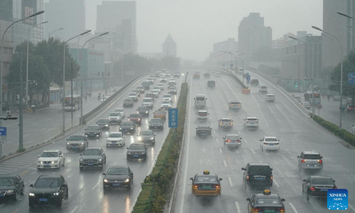 Vehicles move in the rain on a road in Haidian District, Beijing, capital of China, on July 29, 2023. Impacted by Typhoon Doksuri, the fifth typhoon of this year, heavy rainfall has hit regions in northern China, including Beijing, Hebei and Shandong. Photo:Xinhua