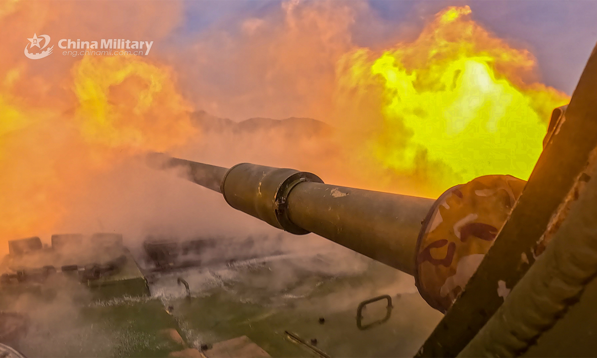 An Amphibious assault vehicle attached to a brigade under the PLA 73rd Group Army fires at mock target during a live-fire training exercise held recently. Photo:China Military