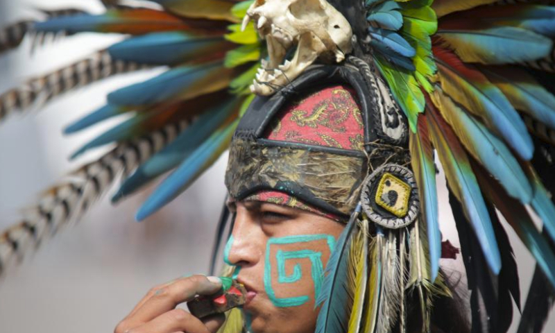 A dancer performs during the celebration for the 698th anniversary of the foundation of Tenochtitlan at Zocalo square in Mexico City, Mexico, July 26, 2023. (Photo by Francisco Canedo/Xinhua)