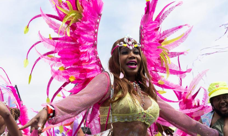 Dressed-up revelers perform on the stage during the Grand Parade of the 2023 Toronto Caribbean Carnival in Toronto, Canada, on Aug. 5, 2023. (Photo by Zou Zheng/Xinhua)