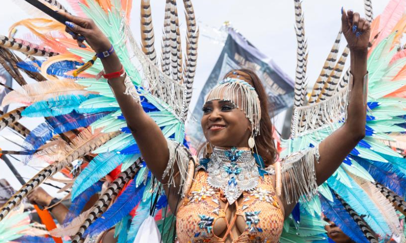 A dressed-up reveler performs on the stage during the Grand Parade of the 2023 Toronto Caribbean Carnival in Toronto, Canada, on Aug. 5, 2023. (Photo by Zou Zheng/Xinhua)