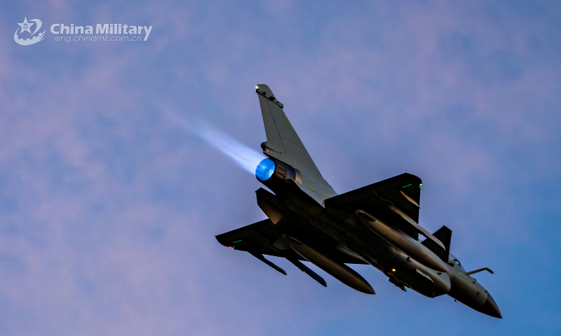 A J-10 fighter jet attached to an aviation brigade of the air force under the PLA Southern Theater Command takes off towards a training airspace at sunrise during a recent flight training exercise. (eng.chinamil.com.cn/Photo by Hou Kaiwen)  