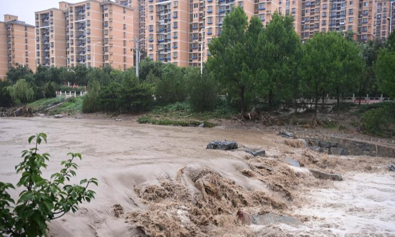 The water level of the Mentougou section of the Yongding River rises due to persistent rainfall in recent days in Mentougou district of Beijing, July 31, 2023. (Photo: China News Service/Tian Yuhao)