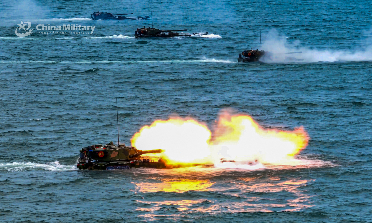 Amphibious assault vehicles attached to a brigade under the PLA 73rd Group Army fire at mock targets during a live-fire training exercise held recently. Photo:China Military