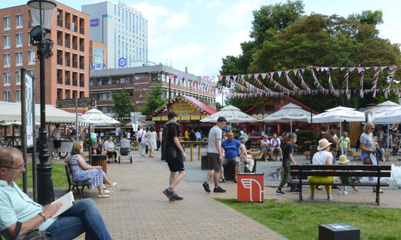 People enjoy themselves at St. Dominic's Fair in Gdansk, Poland, July 30, 2023. The St. Dominic's Fair is held in Poland's port city of Gdansk from July 22 to Aug. 13 this year. (Xinhua/Chen Chen)