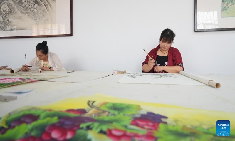 Workers paint at a workshop in Juye County, Heze City of east China's Shandong Province, July 24, 2023.
There are over 20,000 people involved in the calligraphy and painting industry in the county, creating more than 1.2 million works every year. The works are exported to more than 40 countries and regions. (Xinhua/Wu Feizuo)