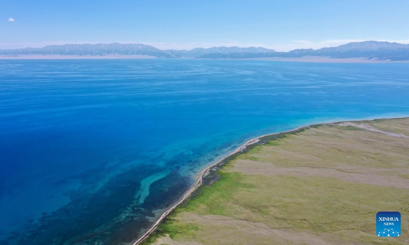 This aerial photo taken on July 25, 2023 shows a view of Sayram Lake in Bortala Mongolian Autonomous Prefecture, northwest China's Xinjiang Uygur Autonomous Region. (Xinhua/Ding Lei)