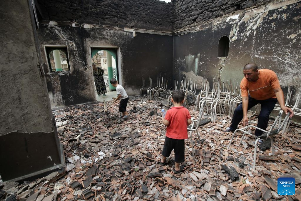 A man inspects a house burned in a wildfire in Bejaia Province, Algeria, on July 25, 2023. The death toll from wildfires in northern Algeria has risen to 34, including 10 soldiers, the Interior Ministry said in an update on Monday. The fires started overnight on Sunday mainly in the provinces of Bejaia, Jijel, and Bouira, but quickly spread due to strong winds, causing significant damage. (Xinhua)