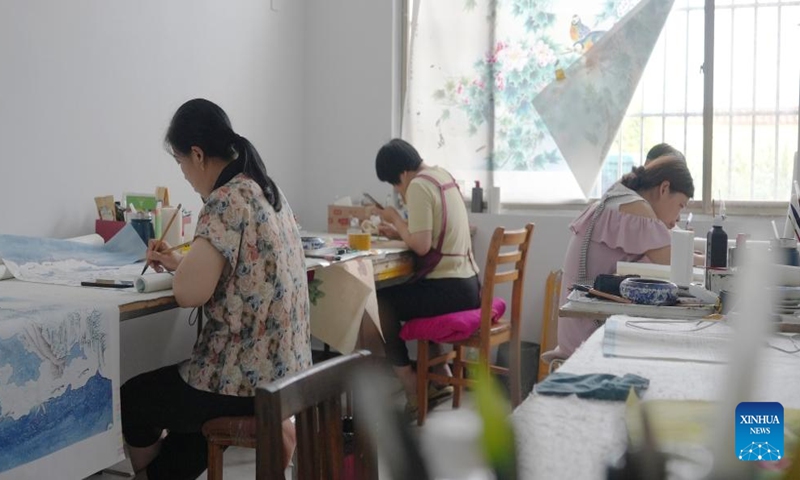 Workers paint at a workshop in Juye County, Heze City of east China's Shandong Province, July 24, 2023.
There are over 20,000 people involved in the calligraphy and painting industry in the county, creating more than 1.2 million works every year. The works are exported to more than 40 countries and regions. (Xinhua/Wu Feizuo)