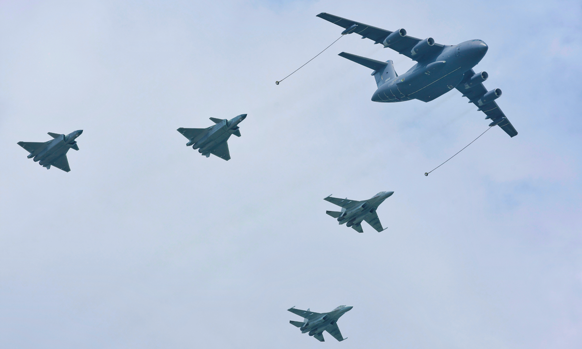 A YU-20 aerial tanker performs mock aerial refueling for a J-20 fighter jet and a J-16 fighter jet, escorted by another J-20 and another J-16, at the Chinese People's Liberation Army Air Force open-day event held in Changchun, Northeast China's Jilin Province, on July 26, 2023. Photo: Li Hao/GT