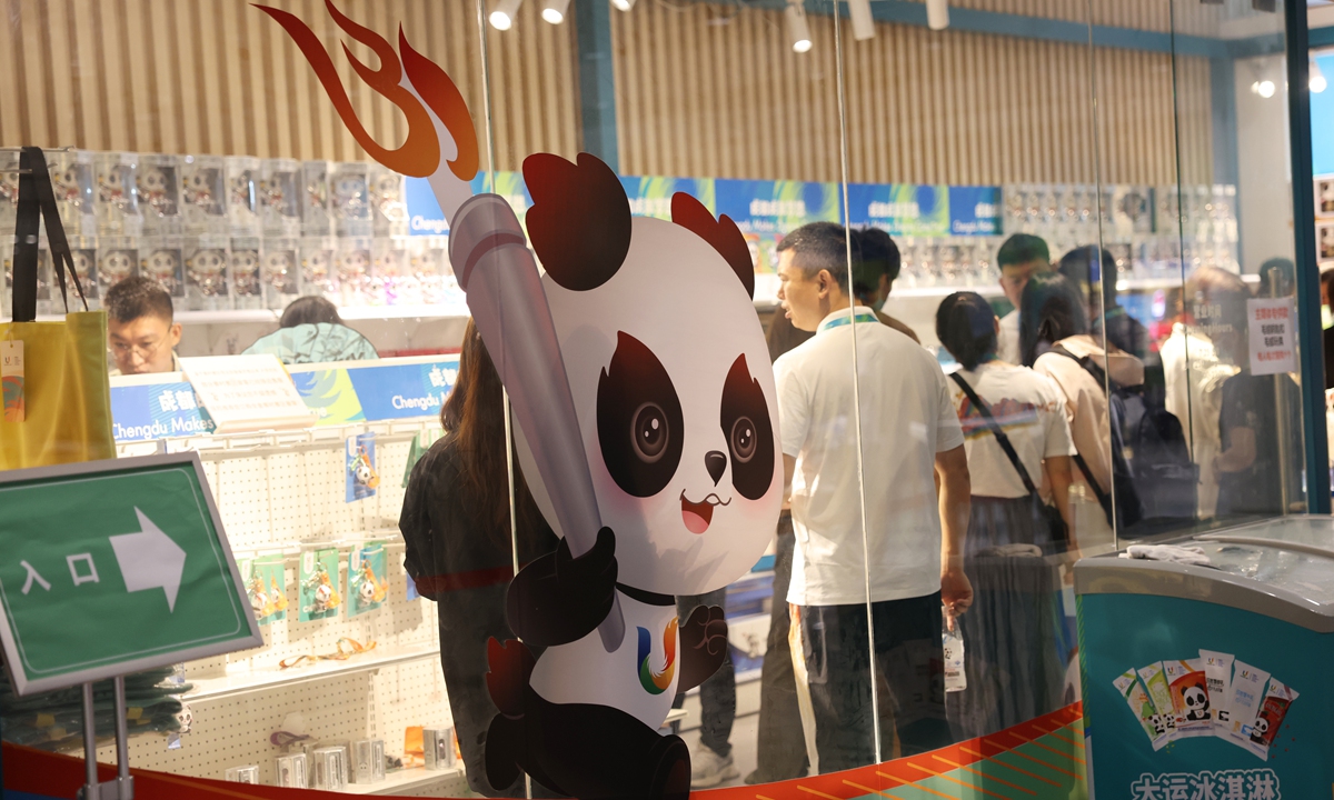 

Journalists browse souvenirs in the licensed merchandise store of the Main Media Center (MMC) of the 31st FISU Summer World University Games in Chengdu,Southwest China's Sichuan Province. The MMC of the Chengdu Universiade officially opened on July 25, from where a large number of news reports will be transmitted to the world. Photo: VCG