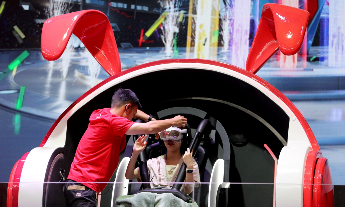 A visitor tries out a 3D simulation cockpit at the 20th China Digital Entertainment Expo and Conference, commonly known as ChinaJoy 2023 on July 28, 2023. The event is being held at the Shanghai New International Expo Center through July 31. This ACG carnival has attracted some 500 exhibitors from 22 countries and regions. Photo: Chen Xia/GT