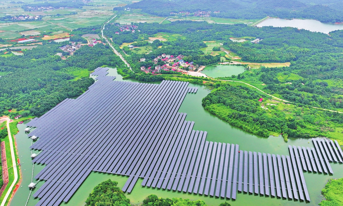 An aerial photo shows photovoltaic (PV) power generation panels on the water surface in Fuzhou, East China's Jiangxi Province on July 30, 2023, which can support fish farming and power generation at the same time. The local government has been developing PV projects catering to local conditions to achieve economic and environmental benefits, and to promote the revitalization of rural industries. Photo: VCG