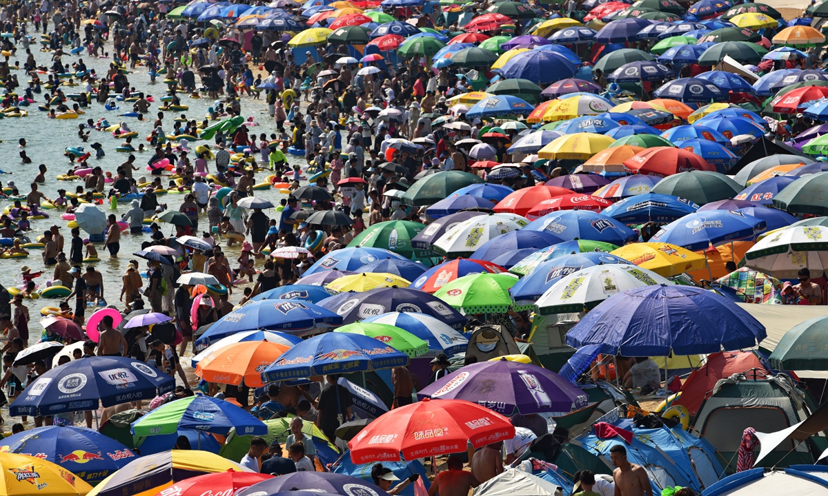 The colorful beach in Dalian, Northeast China's Liaoning Province on August 8, 2023. Under the sun, citizens and tourists come here to bathe in the sea, swim, exercise and cool down. Photo: IC