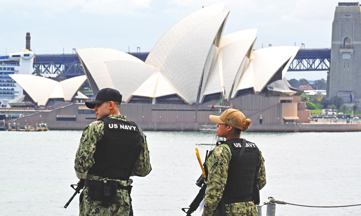 Australia's Opera House is seen past military personnel on board a US warship in Sydney on November 4, 2022. Photo: AFP