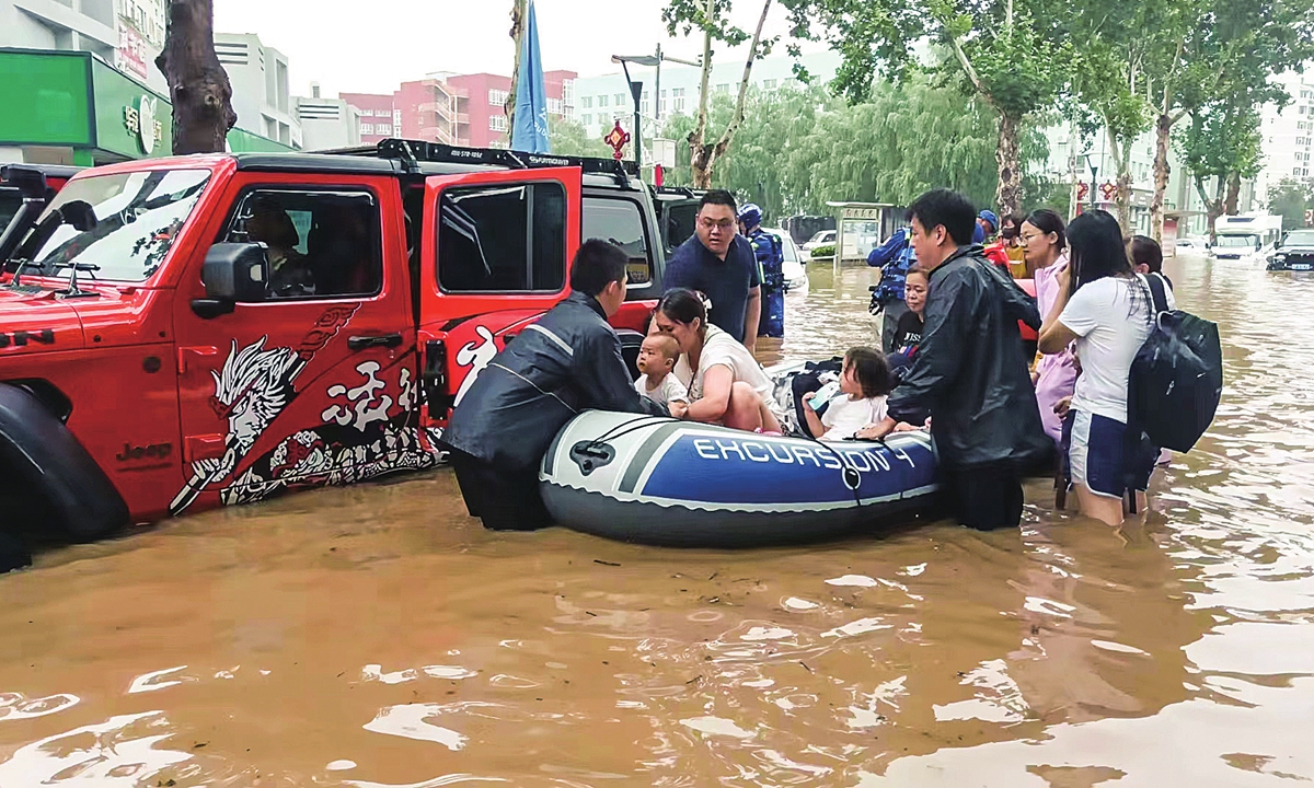 A Chinese civil relief team evacuates victims affected by flooding in Beijing's Fangshan district on August 1, 2023. Photo: Courtesy of Blue Sky rescue team