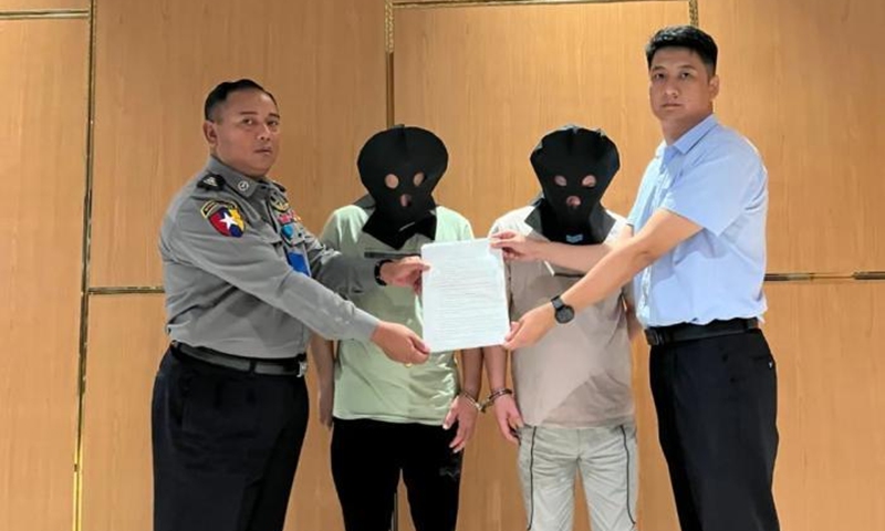 Two suspects of telecom fraud are handed over by Myanmar to the Chinese police at Yangon International Airport and escorted back to China on August 23, 2023. Photo: Chinese Embassy in Myanmar