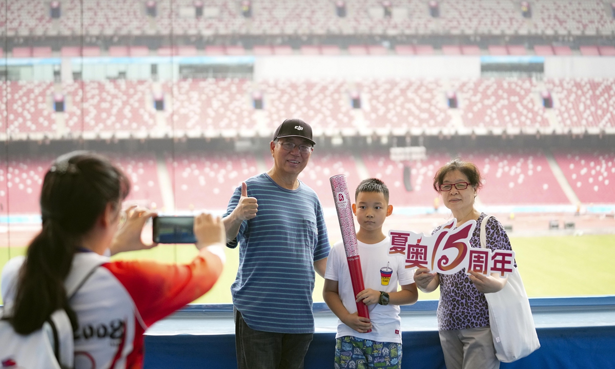 Visitors have a photo taken inside the National Stadium in Beijing on August 8, 2023 to mark the 15th anniversary of the Beijing 2008 Olympics. Photos: VCG
