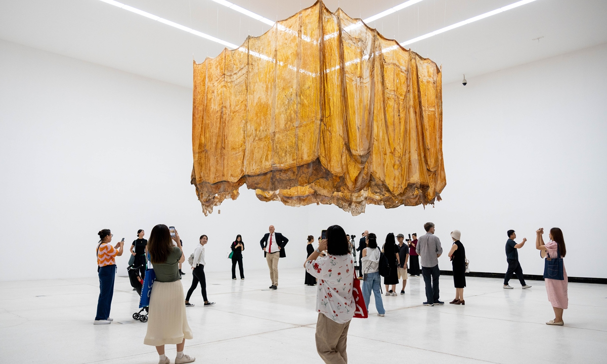 Visitors explore the exhibition Photo: Courtesy of Red Brick Art Museum