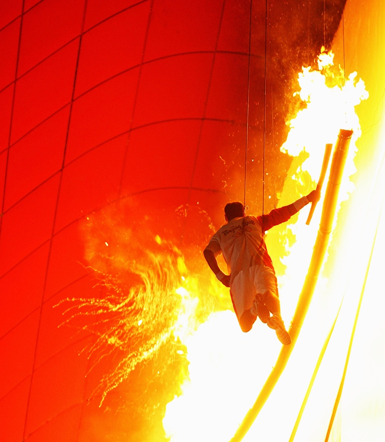 Gymnast Li Ning lights the Olympic Flame during the Opening Ceremony for the Beijing 2008 Olympics at the National Stadium on August 8, 2008 in Beijing.
