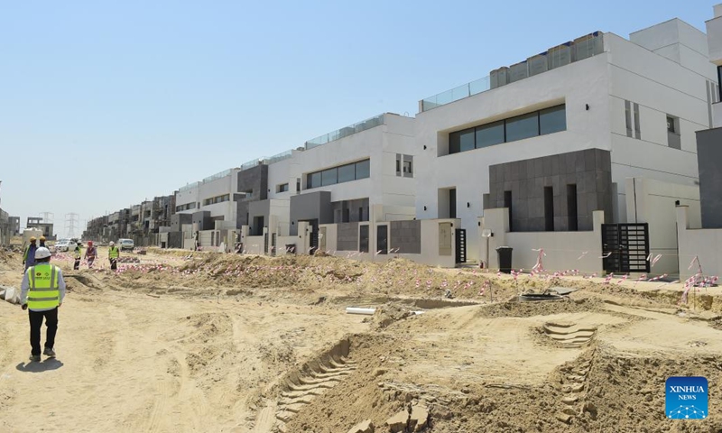 Workers are seen at the construction site of a housing project undertaken by Chinese enterprises in Ahmadi Governorate, Kuwait, Aug. 6, 2023. The housing project, jointly constructed by Power Construction Corporation Of China (PowerChina) and China Railway Group Limited (CREC), is located in Ahmadi Governorate. With 597 residential buildings and stores, as well as other infrastructure constructions, the total area is approximately 630,000 square meters. The project is planed to be completed in 2024.(Photo: Xinhua)