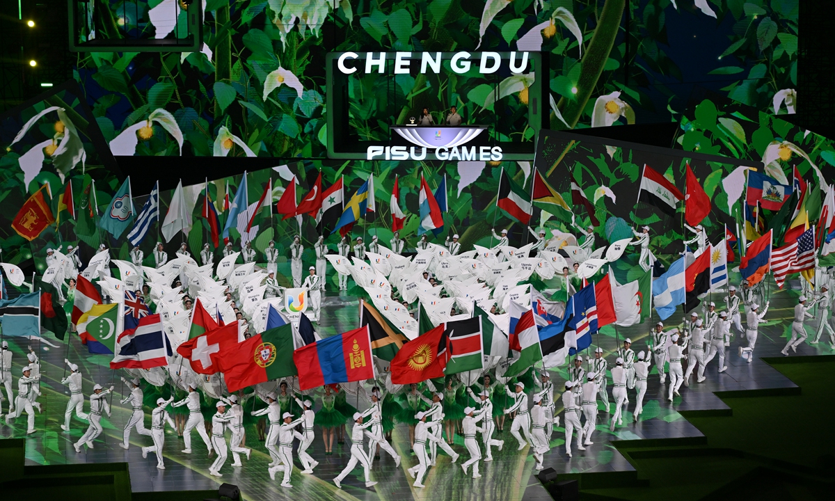 Flag bearers and placard bearers parade during the closing ceremony of the 31st FISU Summer World University Games in Chengdu, Southwest China's Sichuan province, August 8, 2023. Photo: VCG