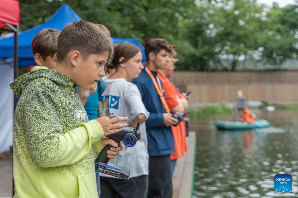 Players compete during a ship model race in Vladivostok, Russia, Aug. 8, 2023. An international ship-modeling race took place here on Tuesday, attracting about 50 players bringing different classes of ship models to the event.(Photo: Xinhua)