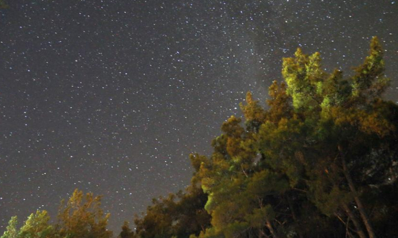 A Perseid meteor shower is pictured over Turkish resort city of Antalya on Aug. 12, 2023. (Mustafa Kaya/Handout via Xinhua)