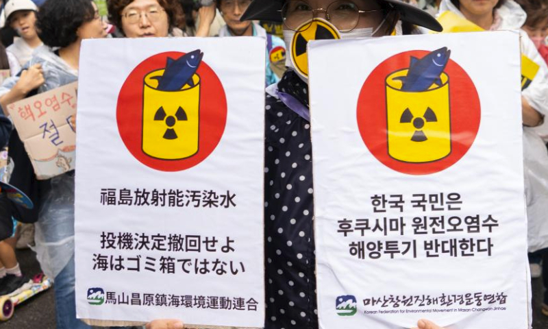 People attend a rally to protest against the Japanese government's plan to discharge nuclear-contaminated wastewater into the sea in Seoul, South Korea, Aug. 12, 2023. (Photo by James Lee/Xinhua)