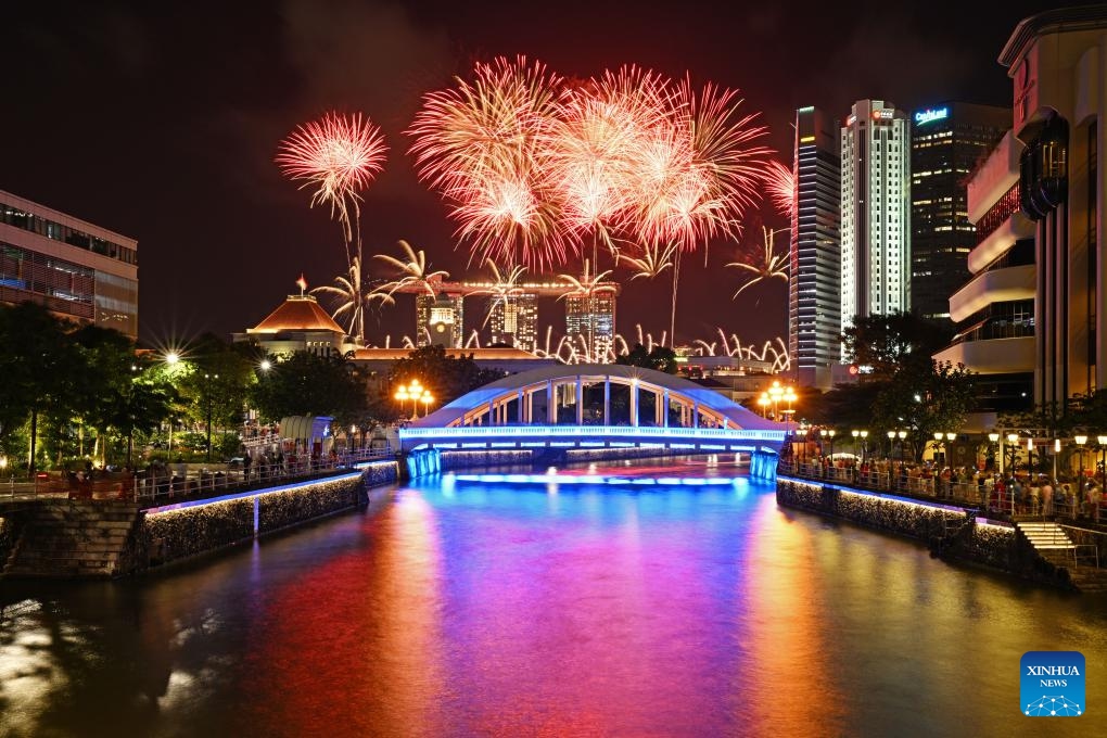 Fireworks light up the sky during the National Day Parade at Singapore's Padang on Aug. 9, 2023. Singapore held a National Day Parade on Wednesday to celebrate its 58th anniversary at Padang, an open playing field near the iconic Marina Bay, with a military show, performances and fireworks.(Photo: Xinhua)