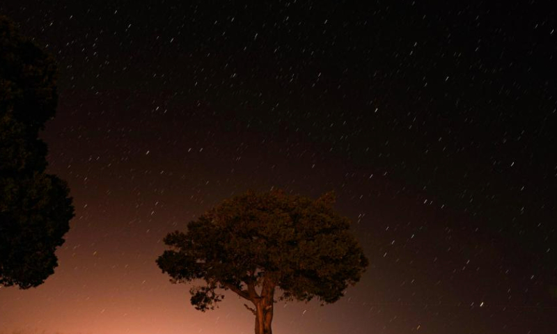 A Perseid meteor shower is pictured over Turkish resort city of Antalya on Aug. 12, 2023. (Mustafa Kaya/Handout via Xinhua)