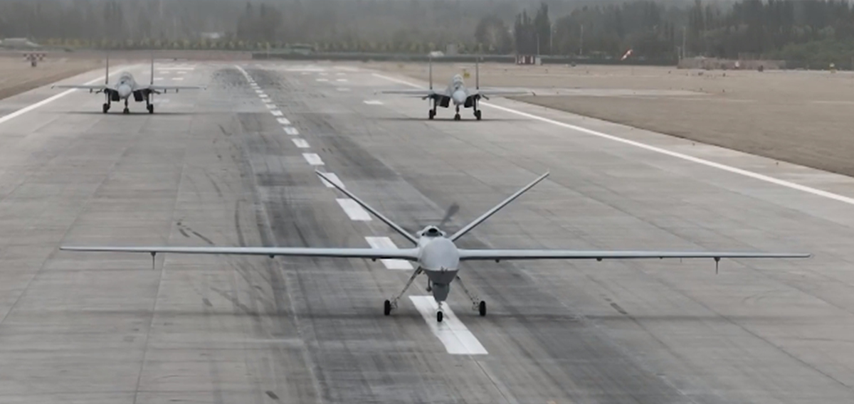 A GJ-2 armed reconnaissance drone of the Chinese People’s Liberation Army Air Force readies for takeoff, to be followed by two J-16 fighter jets. Photo: Screenshot from China Central Television