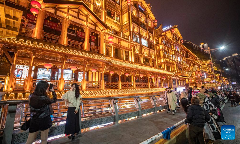 Tourists visit a commercial street in Yuzhong District in southwest China's Chongqing Municipality, Feb 10, 2023. Chongqing has launched a variety of activities at nighttime to boost night economy since the beginning of this year. Photo: Xinhua