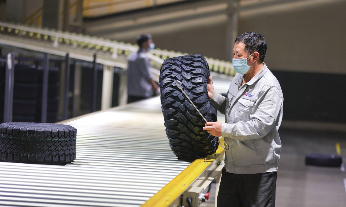 A worker sorts tires at a workshop of a tire manufacturing company in Xingtai, North China's Hebei Province on October 14, 2022. Photo: VCG