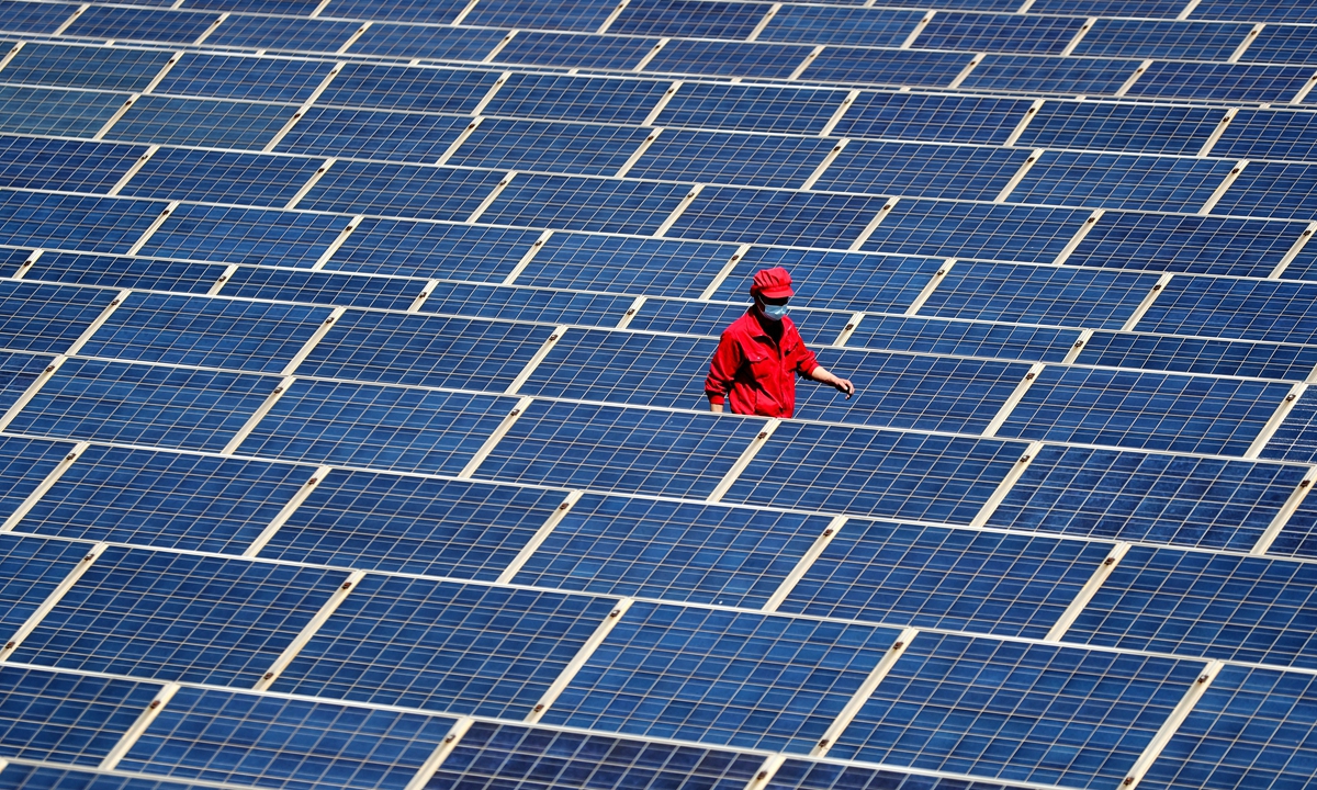 A technician inspects the rooftop photovoltaic (PV) power generation project of a company in Jimo district, East China's Shandong Province on May 4, 2022. Photo: cnsphoto