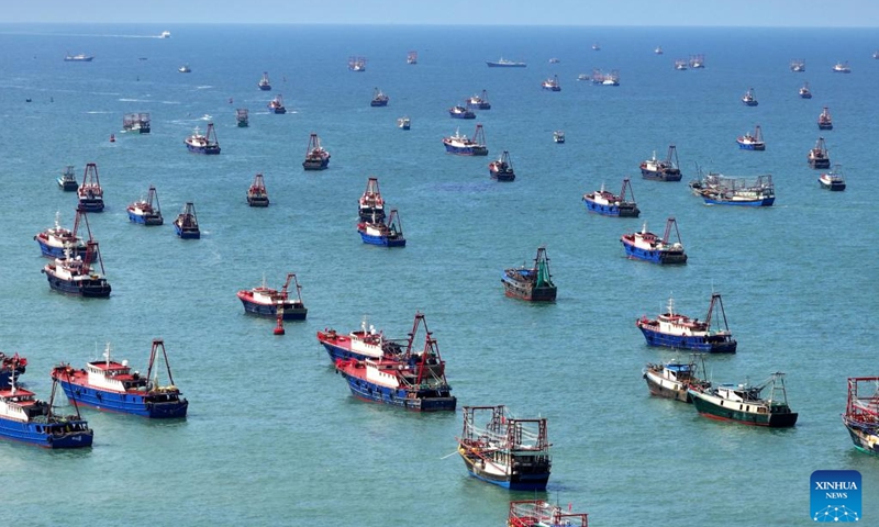This aerial photo taken on Aug. 16, 2023 shows fishing boats sailing off from the Dianjian fishing port in Beihai City, south China's Guangxi Zhuang Autonomous Region. The fishing season of the South China Sea started Wednesday after this summer's three-and-half-month fishing ban.(Photo: Xinhua)