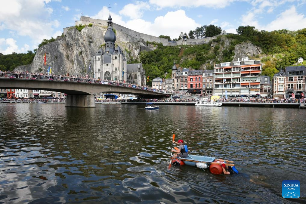 Participants take part in the International Bathtub Regatta on the Meuse River in Dinant, Belgium, on Aug. 15, 2023. Starting in 1982, participants vie to create the most impressive bathtub-based craft and compete down the Meuse River in Dinant on Aug. 15 each year.(Photo: Xinhua)