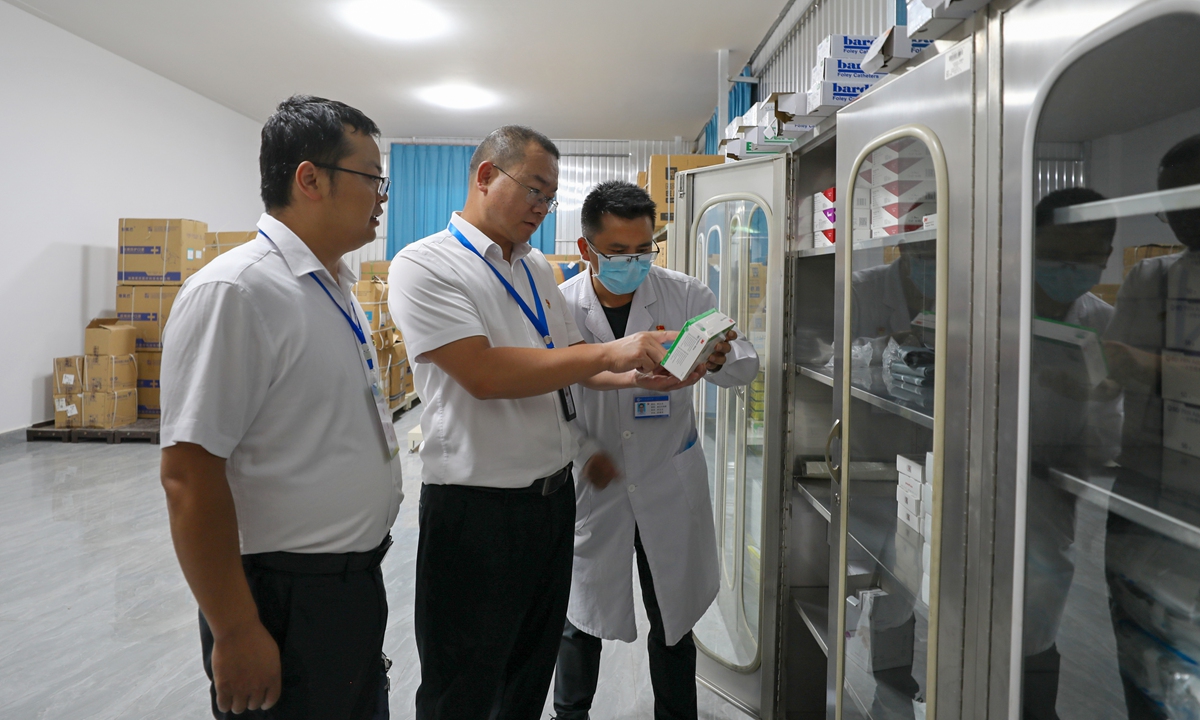 Representatives of the disciplinary watchdog conduct an inspection of drug procurement, sales, and use at a hospital in Luliang county, Southwest China's Yunnan Province, on August 7, 2023. Photos: VCG