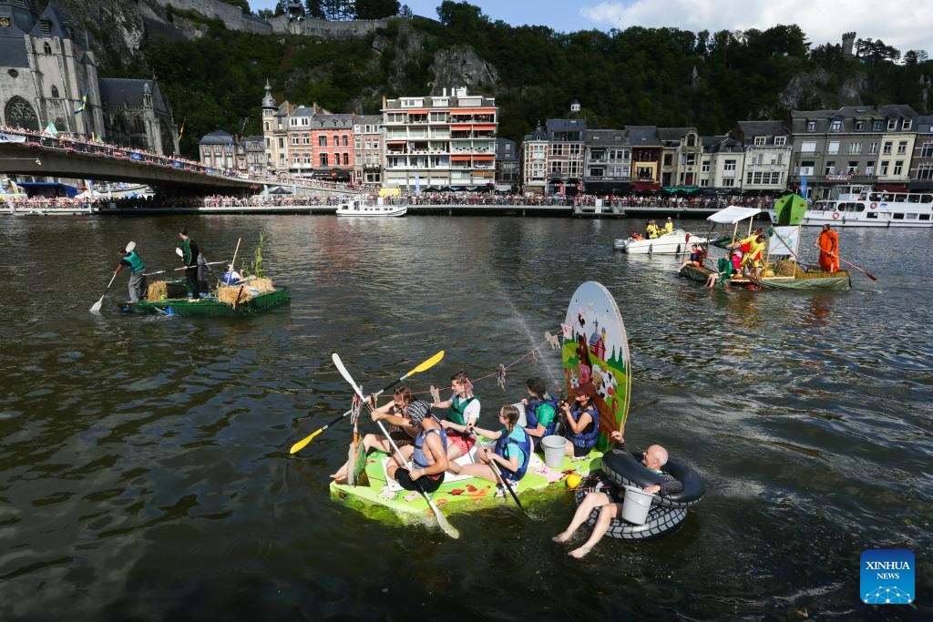 Participants take part in the International Bathtub Regatta on the Meuse River in Dinant, Belgium, on Aug. 15, 2023. Starting in 1982, participants vie to create the most impressive bathtub-based craft and compete down the Meuse River in Dinant on Aug. 15 each year.(Photo: Xinhua)