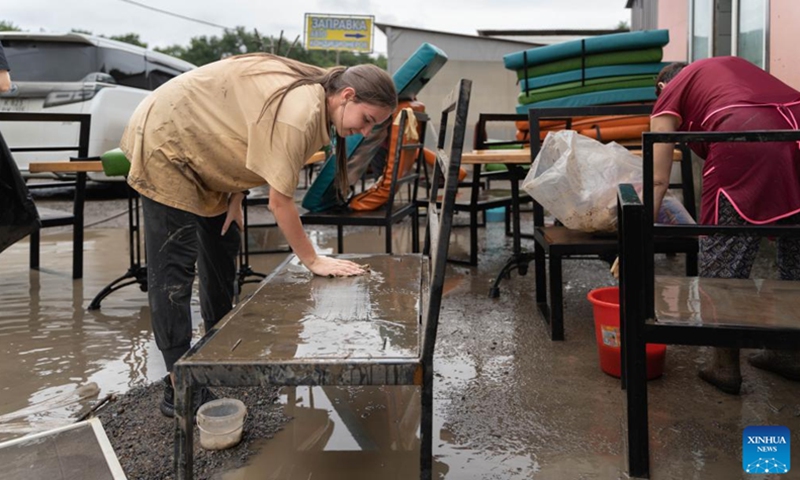 A staff member of a restaurant cleans a furniture soaked by flood water in Ussuriysk, Russia, Aug. 15, 2023. Typhoon Khanun triggered severe floods in Primorsky Krai of Russia's Far East, prompting 21 municipalities to declare a state of emergency, the Russian Ministry of Emergency Situations said on Sunday. The typhoon brought heavy rainfall to Primorsky Krai from Aug. 9 to 11.(Photo: Xinhua)